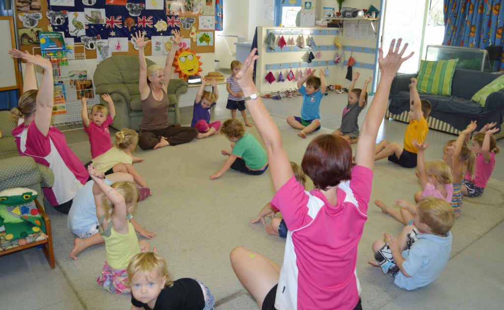 HANDS UP: Children at Tiny Tots enjoy their morning yoga class where they go on safari with instructor Julie Andrew. Photo: Meghan Kidd EME220212yoga35 HANDS UP: Children at Tiny Tots enjoy their morning yoga class where they go on safari with instructor Julie Andrew. Photo: Meghan Kidd EME220212yoga35